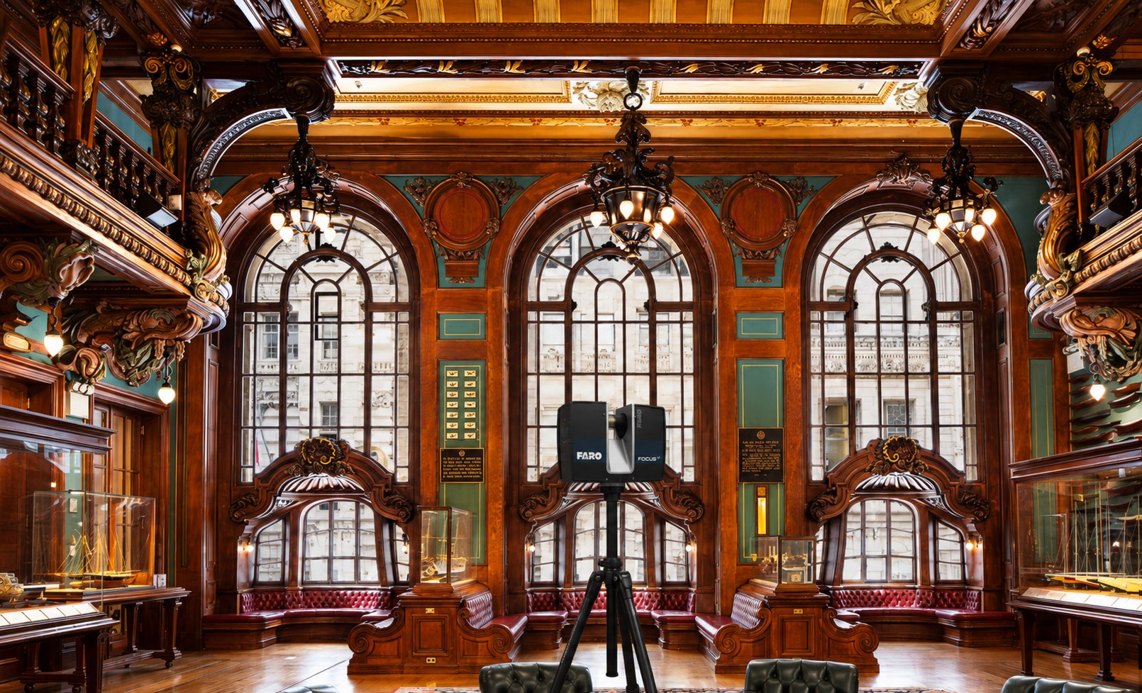 FARO laser scanner set up in the ornate Model Room of the New York Yacht Club with carved woodwork and arched windows