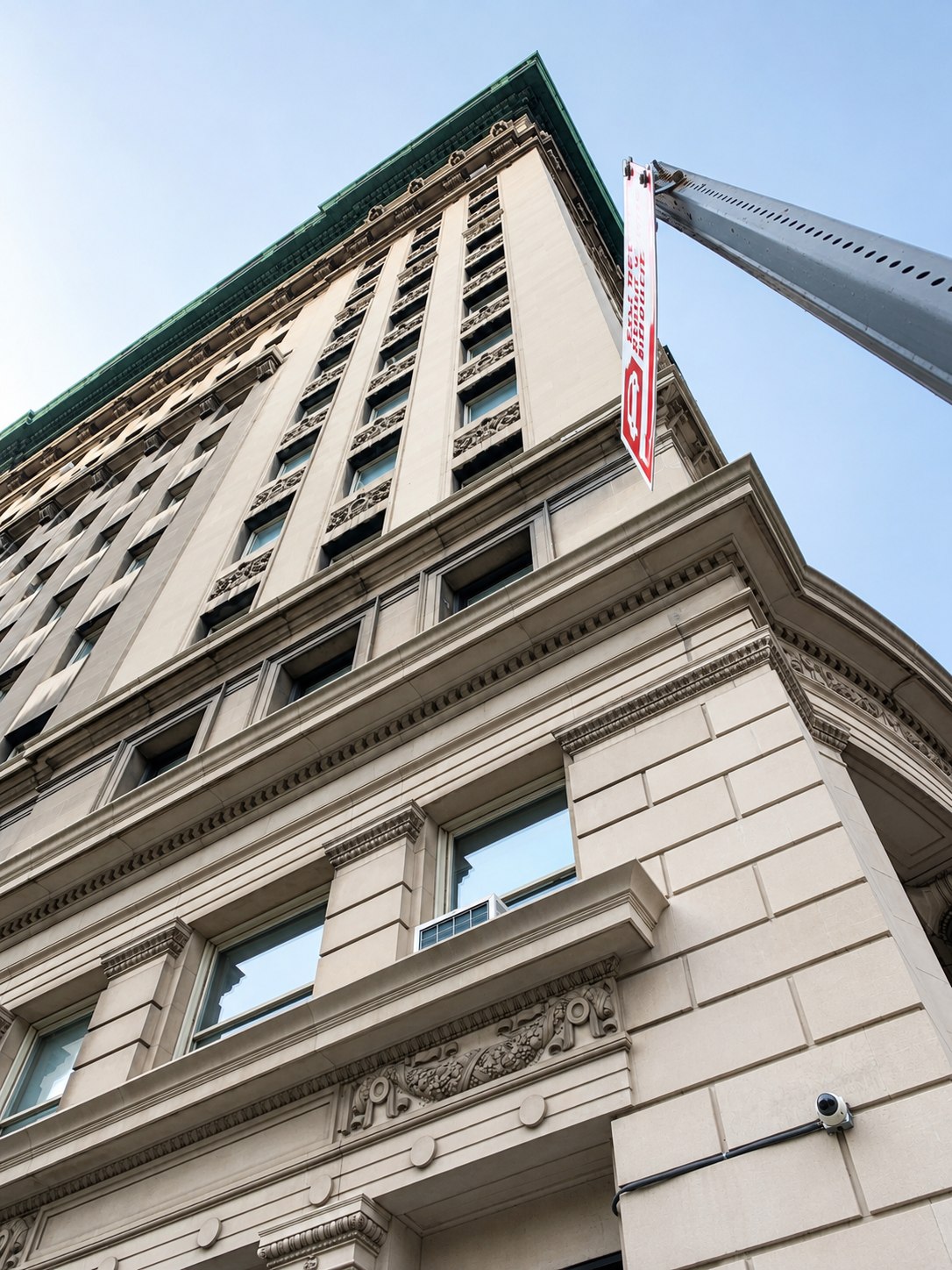 Looking up the limestone facade of the Bank of the Metropolis building at 31 Union Square West, Manhattan