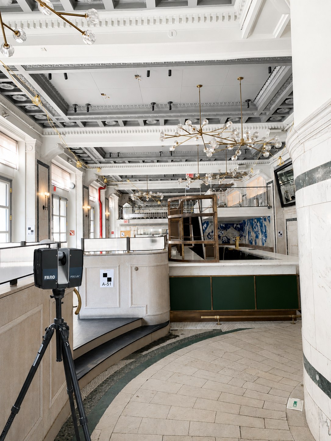 FARO laser scanner set up in the ornate former banking hall at 31 Union Square West, with coffered ceilings, brass chandeliers and marble columns